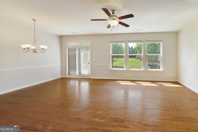 3511 Brockenhurst Dr, Buford, GA 30519 - empty room featuring wood finished floors, a chandelier, and ceiling fan