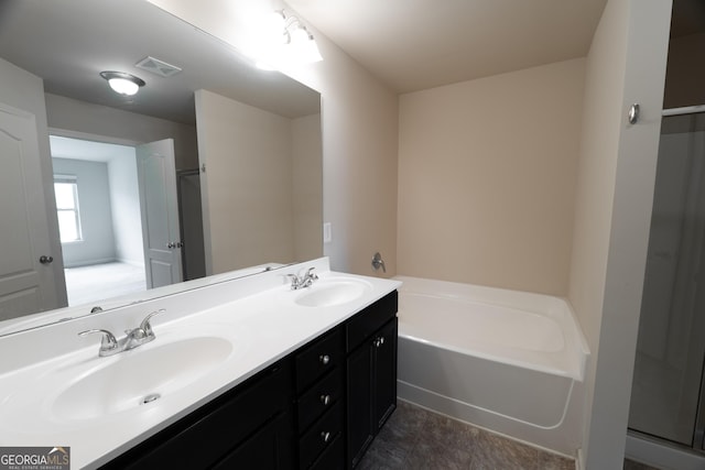 3511 Brockenhurst Dr, Buford, GA 30519 - full bathroom featuring double vanity, a garden tub, and an enclosed shower