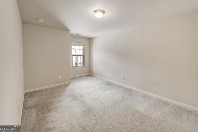 3511 Brockenhurst Dr, Buford, GA 30519 - carpeted spare room featuring baseboards and a smoke detector