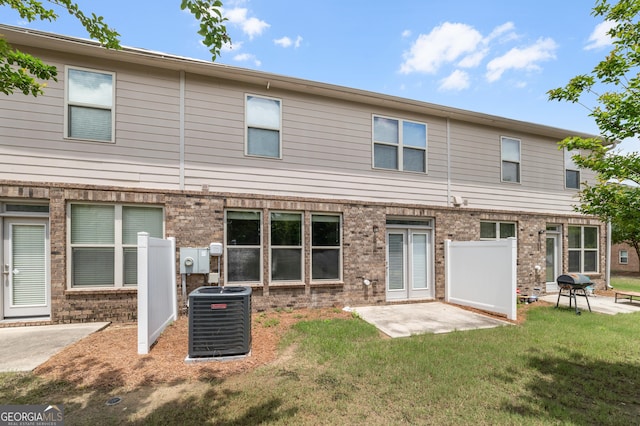 3511 Brockenhurst Dr, Buford, GA 30519 - rear view of property with a lawn, brick siding, and a patio area