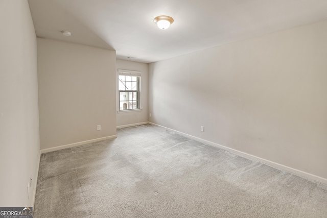 3511 Brockenhurst Dr, Buford, GA 30519 - carpeted spare room featuring baseboards and a smoke detector