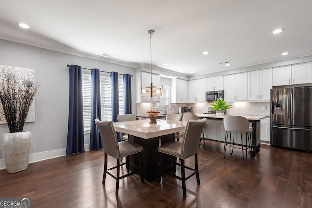 1967 Cogar Dr, Decatur, GA 30032 - dining room featuring dark wood finished floors, crown molding, and recessed lighting
