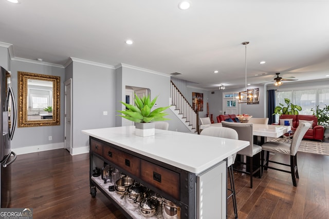 1967 Cogar Dr, Decatur, GA 30032 - kitchen featuring open floor plan, a breakfast bar, freestanding refrigerator, a kitchen island, and recessed lighting