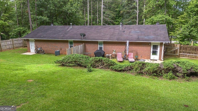 1777 Cedar Shoals Dr Unit 1775, Athens, GA 30605 - rear view of house with brick siding, a fenced backyard, a patio, and a view of trees