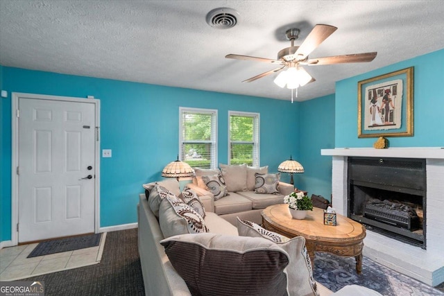 1777 Cedar Shoals Dr Unit 1775, Athens, GA 30605 - tiled living area featuring a fireplace, ceiling fan, and a textured ceiling