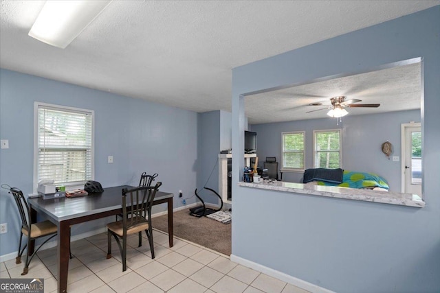 1777 Cedar Shoals Dr Unit 1775, Athens, GA 30605 - dining space featuring a textured ceiling, a ceiling fan, and tile patterned flooring