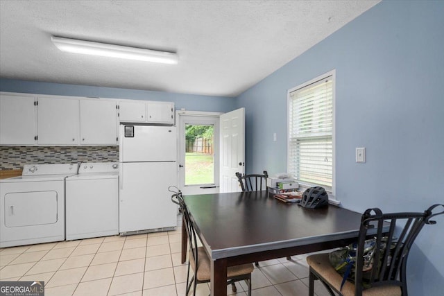 1777 Cedar Shoals Dr Unit 1775, Athens, GA 30605 - dining space featuring washing machine and clothes dryer, light tile patterned flooring, and a textured ceiling
