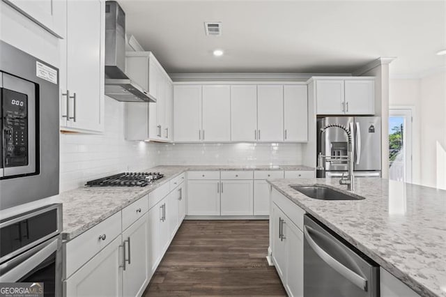 3382 Monarch Ave, Duluth, GA 30096 - kitchen with wall chimney exhaust hood, stainless steel appliances, white cabinetry, decorative backsplash, and light stone countertops