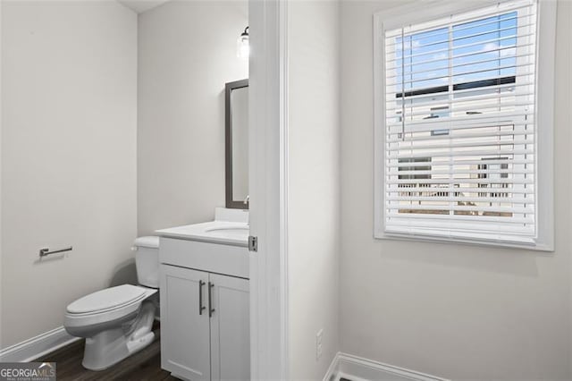 3382 Monarch Ave, Duluth, GA 30096 - half bath featuring vanity and wood finished floors
