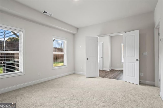 3382 Monarch Ave, Duluth, GA 30096 - unfurnished bedroom with carpet and multiple windows