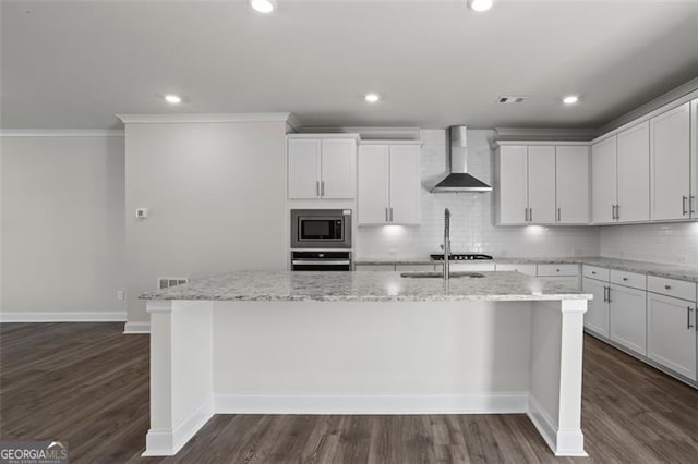 3382 Monarch Ave, Duluth, GA 30096 - kitchen with wall chimney range hood, stainless steel appliances, a center island with sink, crown molding, and tasteful backsplash
