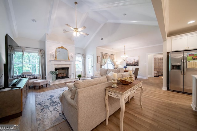 96 Cypress Trl, Fortson, GA 31808 - living room with light wood-style floors, beamed ceiling, healthy amount of natural light, a premium fireplace, and a ceiling fan