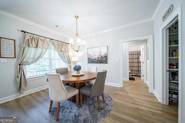 96 Cypress Trl, Fortson, GA 31808 - dining space featuring a chandelier, crown molding, and light wood finished floors