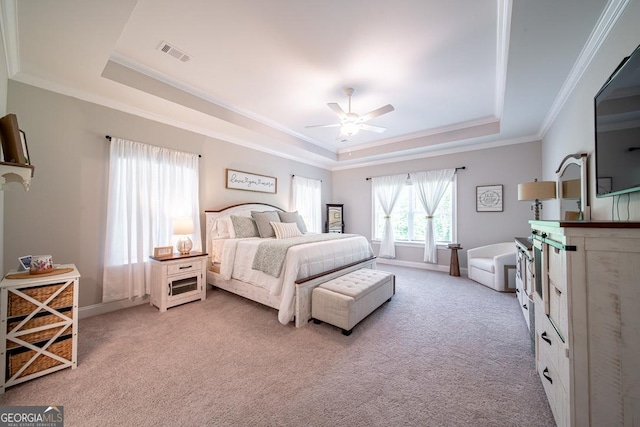96 Cypress Trl, Fortson, GA 31808 - bedroom featuring a tray ceiling, light carpet, crown molding, and ceiling fan
