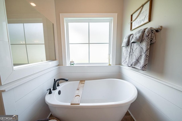 96 Cypress Trl, Fortson, GA 31808 - bathroom featuring a soaking tub and plenty of natural light