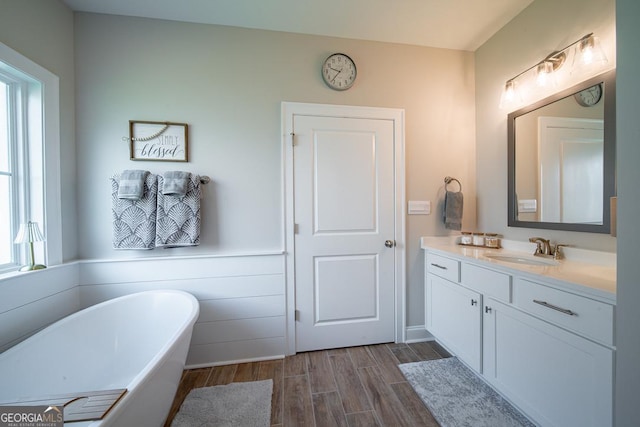 96 Cypress Trl, Fortson, GA 31808 - full bathroom with a soaking tub, vanity, and wood finished floors