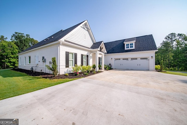 96 Cypress Trl, Fortson, GA 31808 - view of front of home featuring driveway, a front yard, and a garage