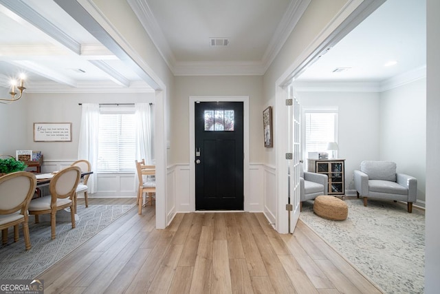 96 Cypress Trl, Fortson, GA 31808 - entryway featuring light wood-style flooring, ornamental molding, a chandelier, a decorative wall, and a wainscoted wall