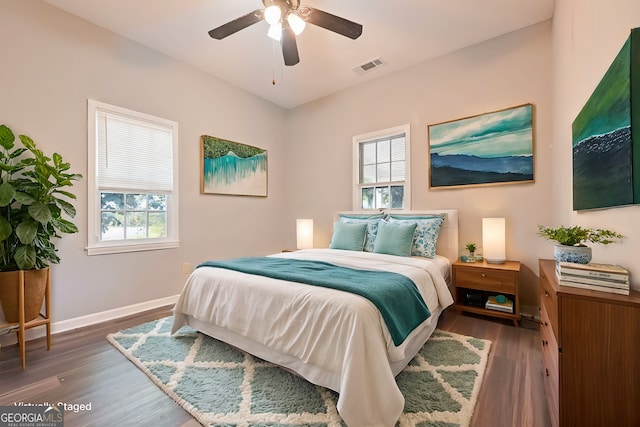 7880 Rivertown Rd, Fairburn, GA 30213 - bedroom with wood finished floors and ceiling fan