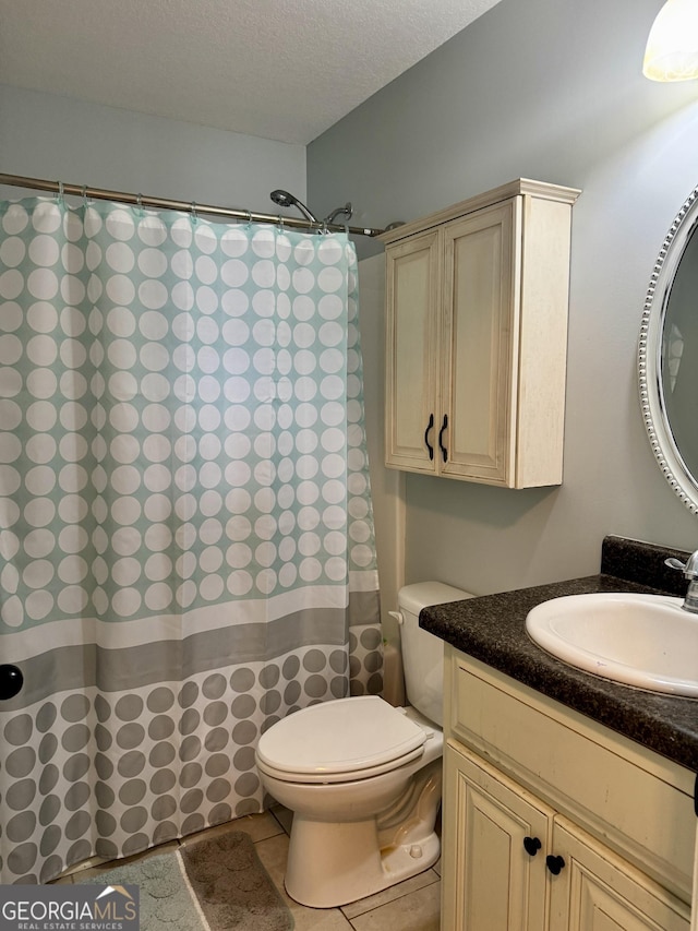 139 Raymond Cir, Warner Robins, GA 31088 - full bathroom featuring vanity, a textured ceiling, curtained shower, and tile patterned flooring