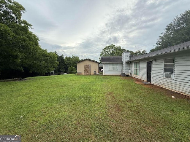 2433 Robin Ridge Dr, Dacula, GA 30019 - view of green lawn featuring a storage unit