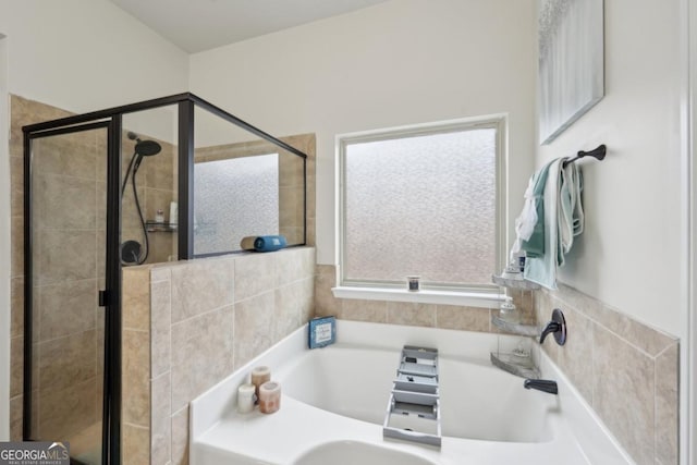 3225 Alhambra Cir, Hampton, GA 30228 - bathroom with a garden tub and a stall shower