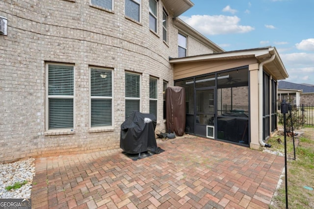 3225 Alhambra Cir, Hampton, GA 30228 - view of patio featuring a sunroom and grilling area
