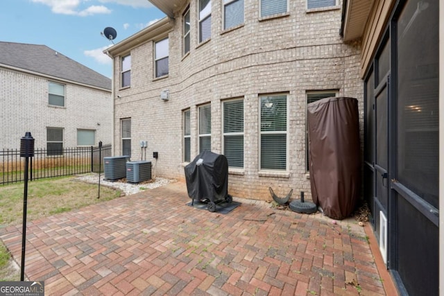 3225 Alhambra Cir, Hampton, GA 30228 - back of house with a patio area and brick siding