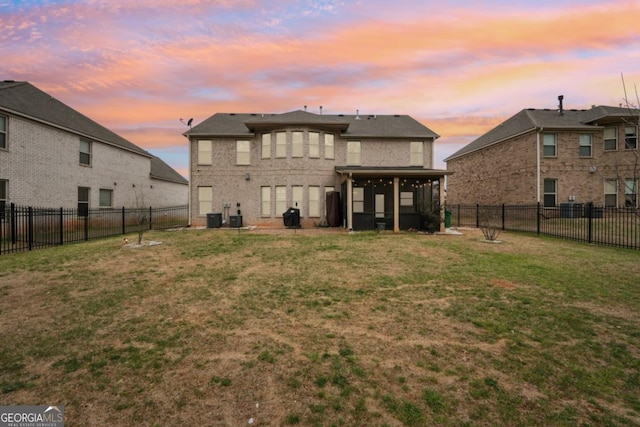 3225 Alhambra Cir, Hampton, GA 30228 - rear view of property with a sunroom and a fenced backyard