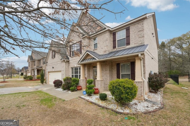 3225 Alhambra Cir, Hampton, GA 30228 - craftsman-style home with brick siding, a standing seam roof, a garage, driveway, and a metal roof