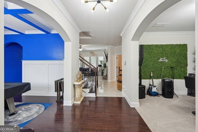3225 Alhambra Cir, Hampton, GA 30228 - foyer entrance featuring stairway, ornamental molding, arched walkways, wood finished floors, and a ceiling fan