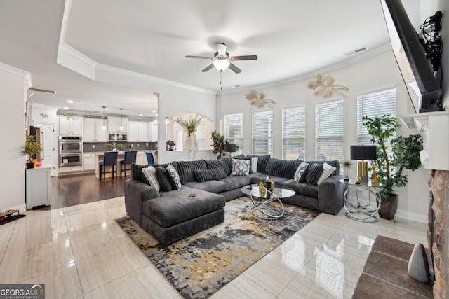 3225 Alhambra Cir, Hampton, GA 30228 - tiled living area featuring ceiling fan and ornamental molding