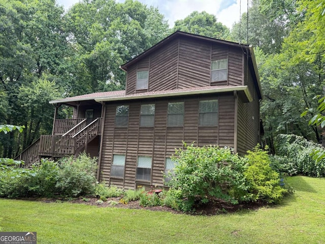 3470 Hill Ln, Acworth, GA 30102 - rear view of property featuring stairway and a lawn
