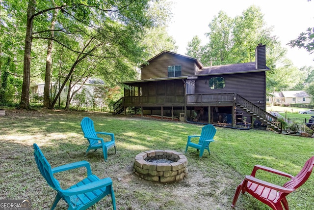 3470 Hill Ln, Acworth, GA 30102 - back of property with stairs, an outdoor fire pit, a sunroom, a chimney, and a wooden deck