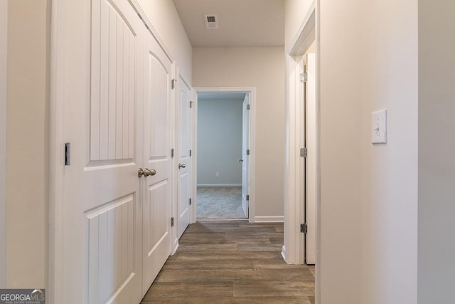 225 Rusty Plow Ln Unit 72, Perry, GA 31069 - hallway with dark wood finished floors and baseboards