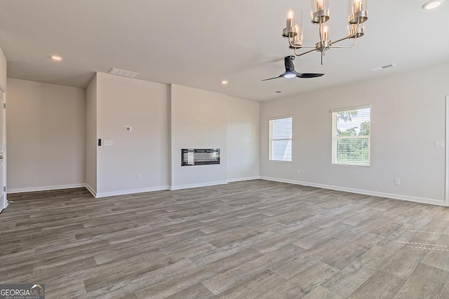 225 Rusty Plow Ln Unit 72, Perry, GA 31069 - unfurnished living room with a chandelier, wood finished floors, recessed lighting, a ceiling fan, and heating unit