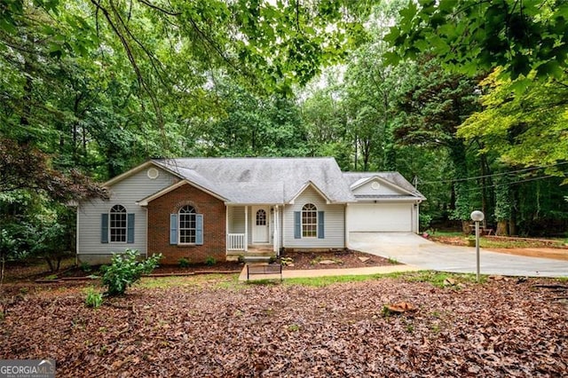 3105 The Trail Rd, Gainesville, GA 30501 - single story home featuring concrete driveway, an attached garage, and view of wooded area