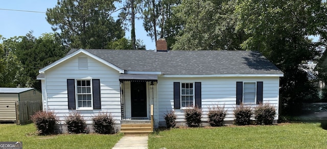 502 S Hull St, Sylvania, GA 30467 - view of front of house featuring a chimney and a shingled roof