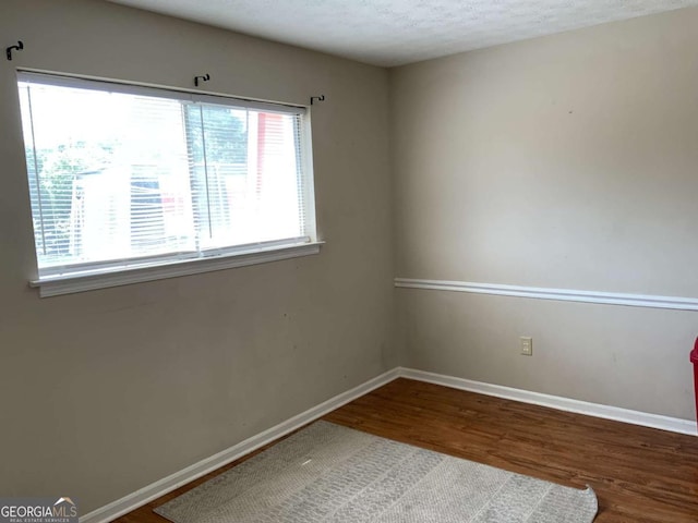 182 Viking Ct Unit 3, Athens, GA 30605 - spare room with wood finished floors and baseboards