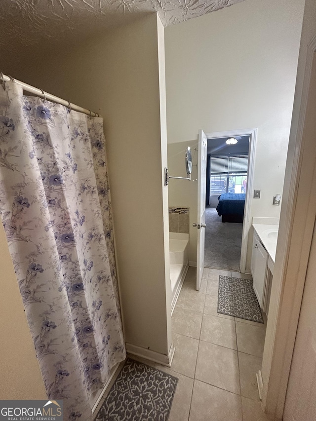 120 Silverbell Trce, Athens, GA 30606 - ensuite bathroom featuring tile patterned flooring, vanity, and a shower with curtain