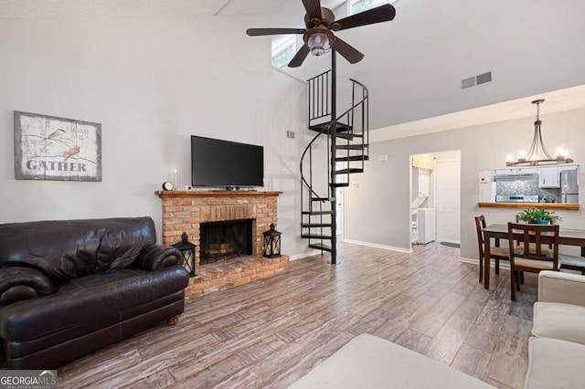 140 Indian Ridge Ct, Waleska, GA 30183 - living room featuring stairs, wood finished floors, high vaulted ceiling, ceiling fan, and a chandelier