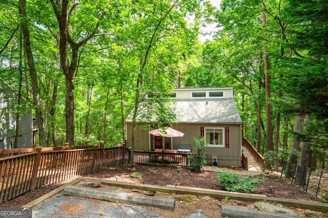 140 Indian Ridge Ct, Waleska, GA 30183 - rear view of house with a deck and a wooded view