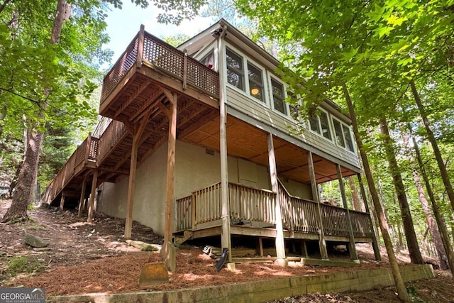 140 Indian Ridge Ct, Waleska, GA 30183 - view of side of property featuring a deck, stairs, and stucco siding