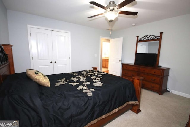 2311 Arnold Palmer Way, Duluth, GA 30096 - bedroom featuring a closet, light carpet, and a ceiling fan