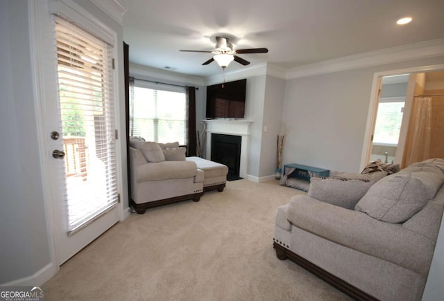 2311 Arnold Palmer Way, Duluth, GA 30096 - living area featuring a fireplace, ornamental molding, a ceiling fan, and light colored carpet