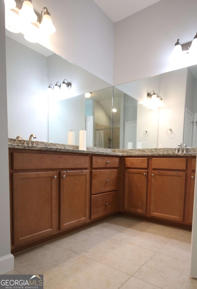 2311 Arnold Palmer Way, Duluth, GA 30096 - bathroom featuring double vanity and tile patterned floors