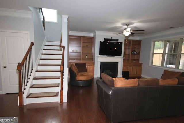 2311 Arnold Palmer Way, Duluth, GA 30096 - living area featuring ornamental molding, stairs, ceiling fan, a fireplace, and wood finished floors