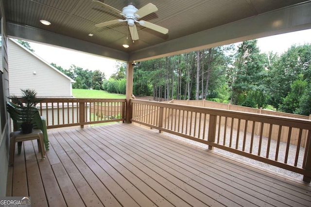 2311 Arnold Palmer Way, Duluth, GA 30096 - deck with ceiling fan, view of wooded area, and a fenced backyard
