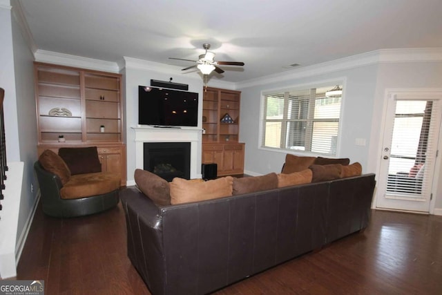 2311 Arnold Palmer Way, Duluth, GA 30096 - living room with dark wood-style floors, ceiling fan, crown molding, and a fireplace