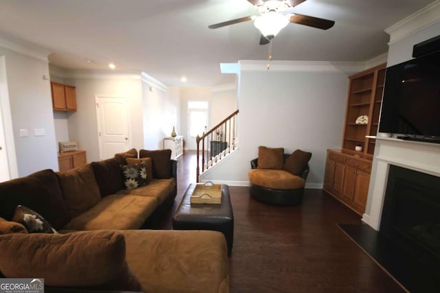 2311 Arnold Palmer Way, Duluth, GA 30096 - living room with crown molding, a ceiling fan, a fireplace, dark wood-style flooring, and stairs